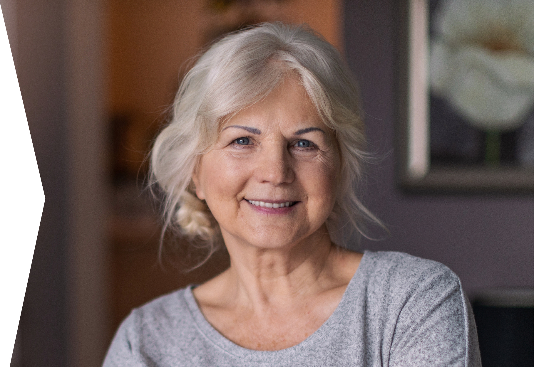 Elderly woman smiling into camera