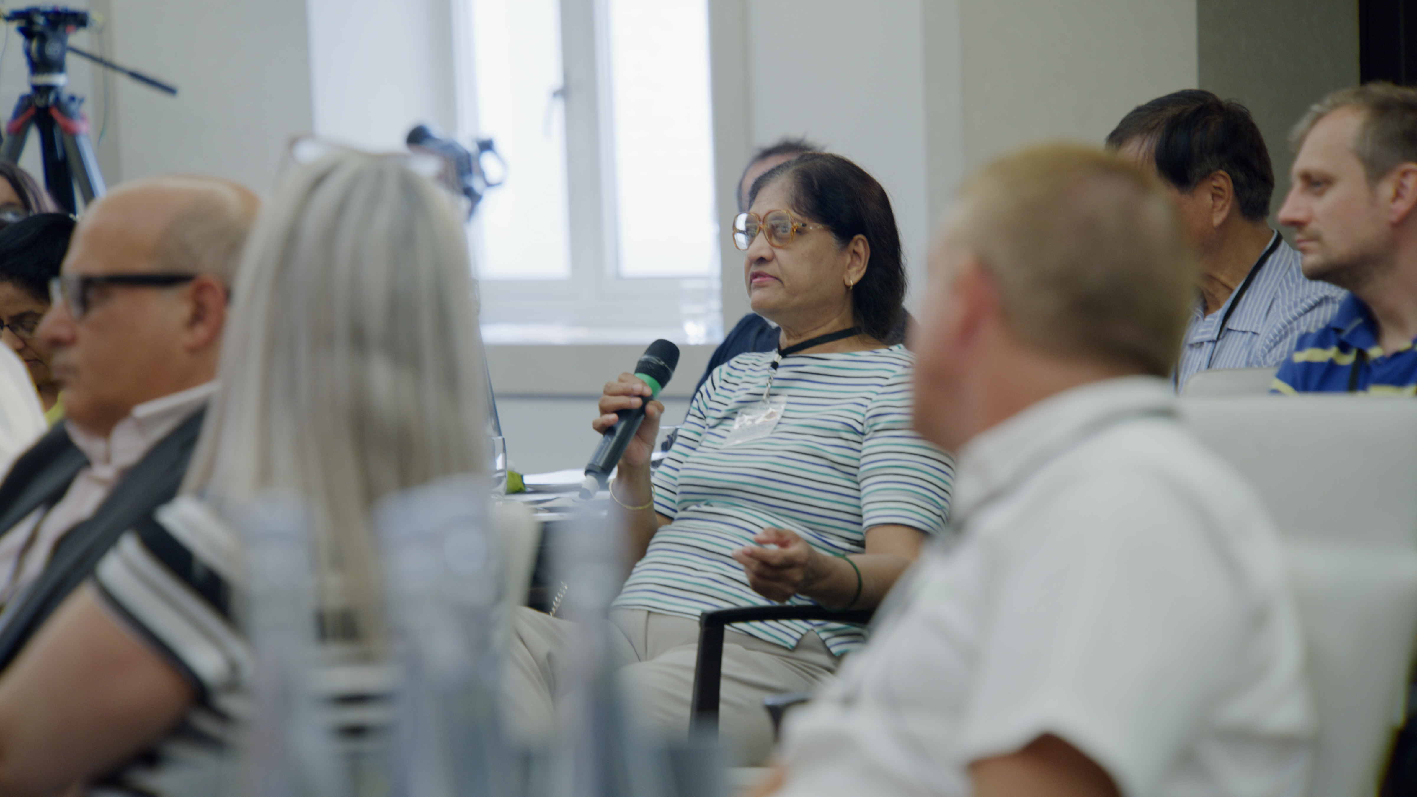 Attendee asking a question to the presenter