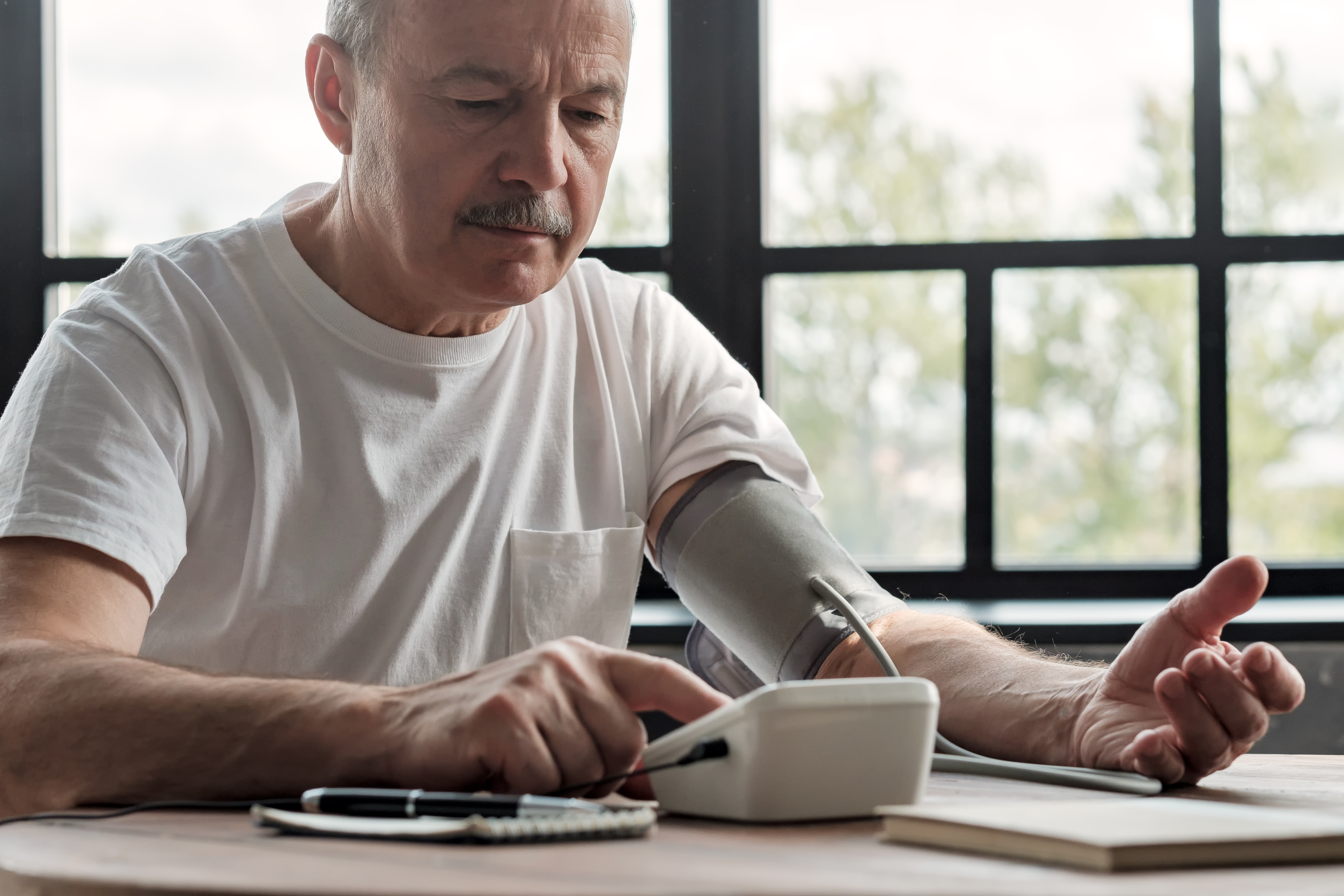man measuring blood pressure